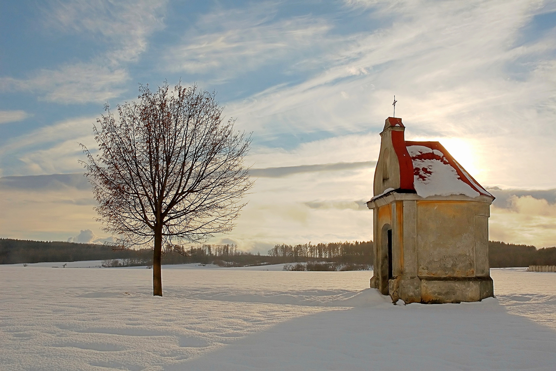 Chapel on snowy field