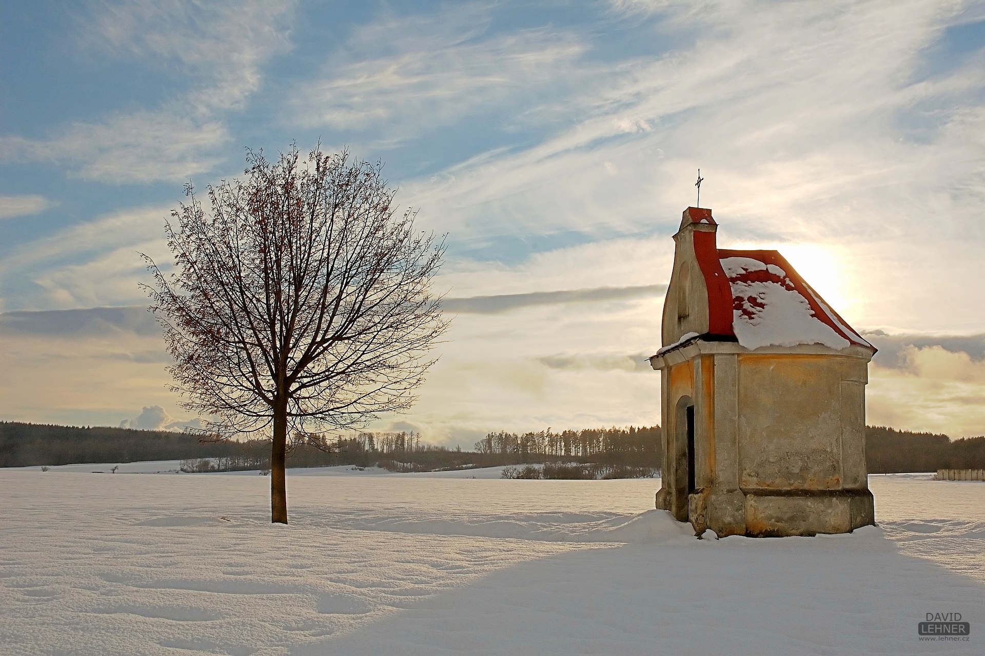 Chapel on snowy field